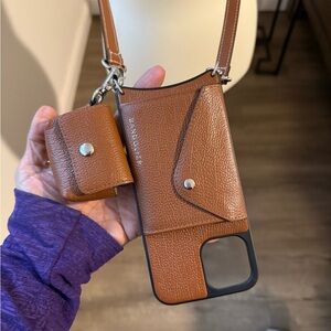 Bandolier Brown Leather Phone Case with Strap with Airpod case.